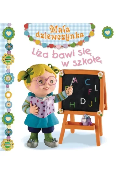Liza bawi się w szkołę. Mała dziewczynka